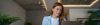 Smiling woman behind laptop